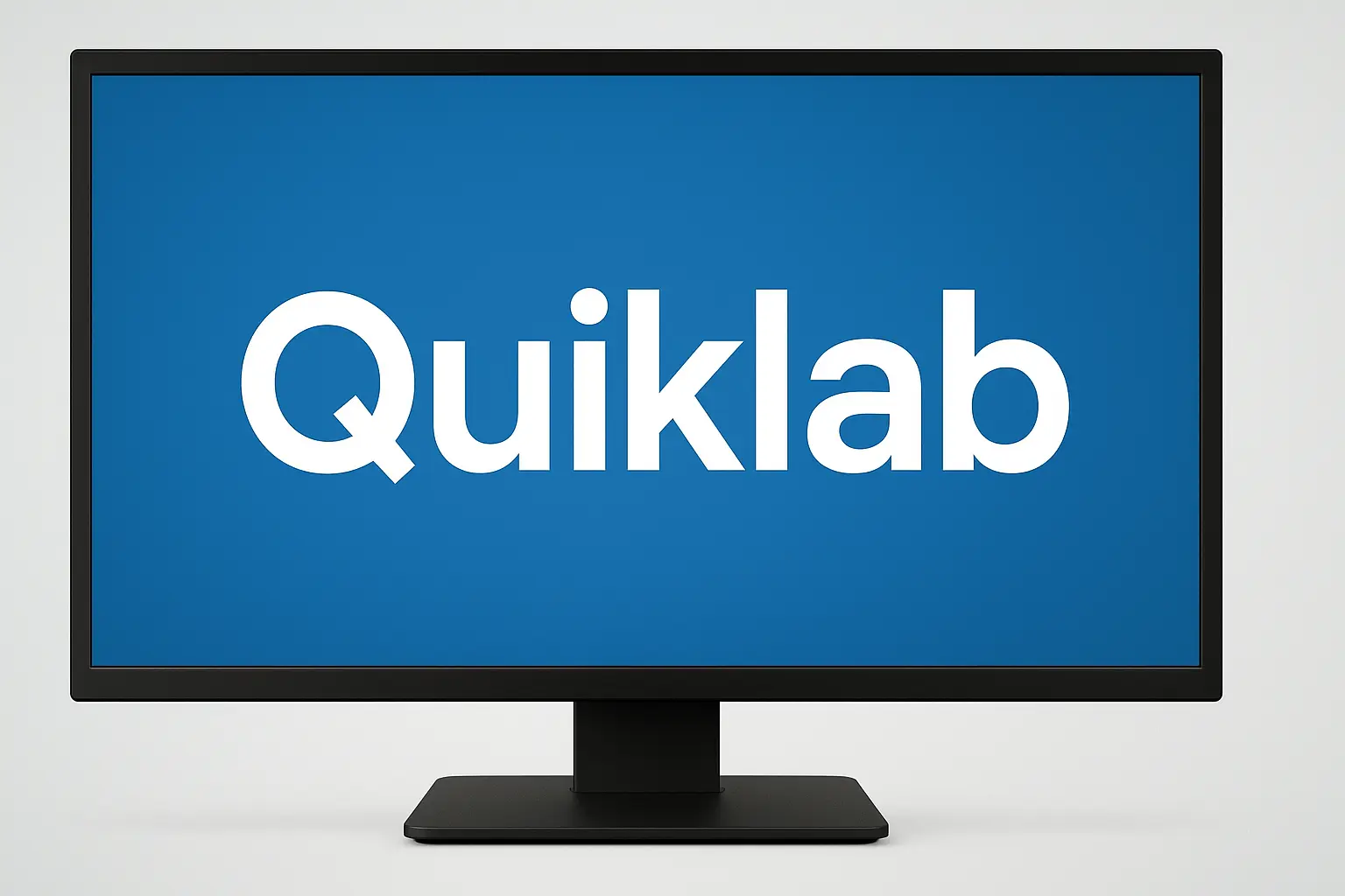 Monitor displaying Quiklab logo